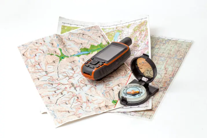 GPS device and compass on a map.