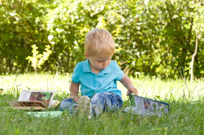 toddler with books