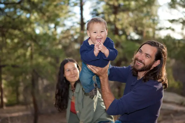 toddler and parents having fun