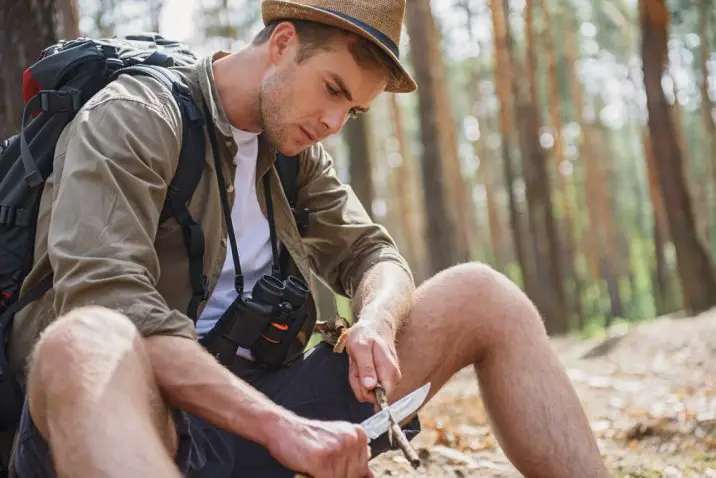 man whittling