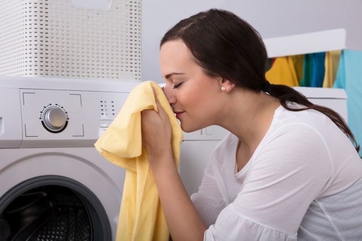 woman smelling laundry