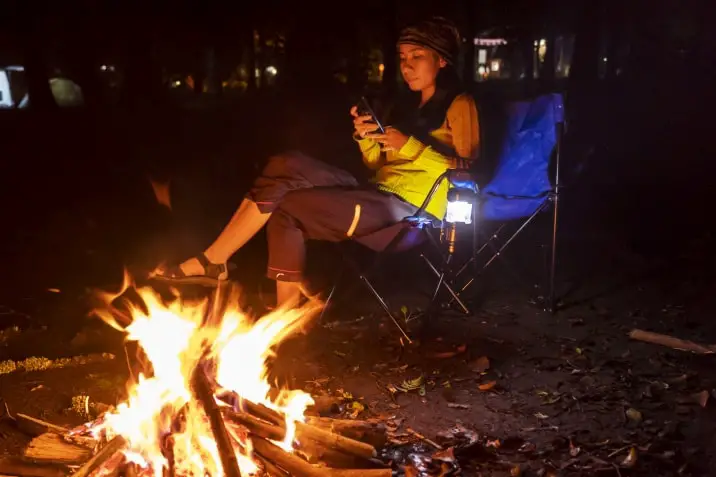 using cellphone by campfire