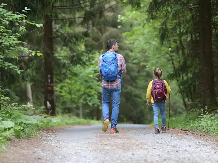 young and old hikers