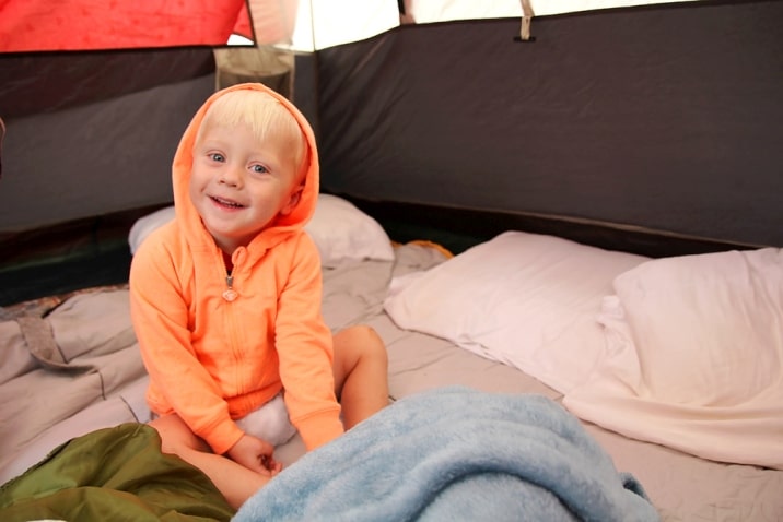 pillows and blankets in tent