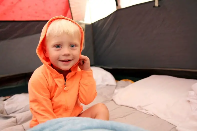 child in a tent